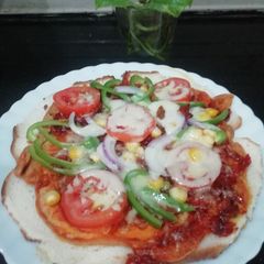 A picture of Bread Pizza on Gram Flour Base.