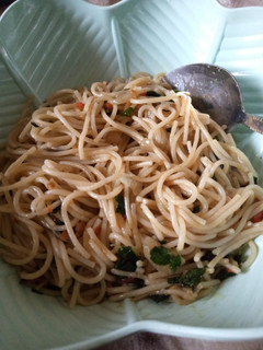 A picture of Jollof spaghetti with moringa.