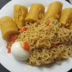 Indomine with boiled plantain and egg A picture of Indomine with boiled plantain and egg.