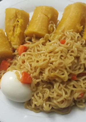 A picture of Indomine with boiled plantain and egg.