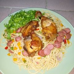 A picture of Stir fry spaghetti and fried chicken.