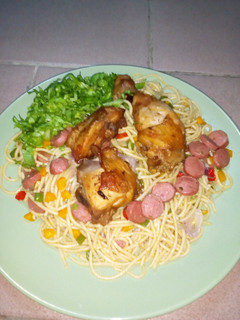 A picture of Stir fry spaghetti and fried chicken.