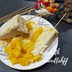 A picture of Indian Mango Ice-cream or Traditional Mango Kulfis.