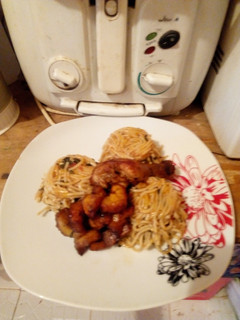 A picture of Jollof spaghetti with ugwu.