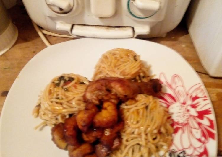 Jollof spaghetti with ugwu