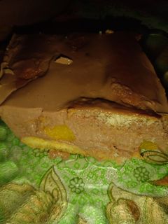 Una foto de Postre Borrachito de Vainillas Flan de chocolate y durazno🍑!!