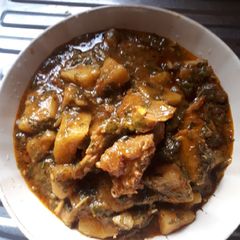 A picture of Yam porridge with vegetable.