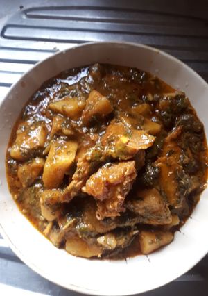 A picture of Yam porridge with vegetable.