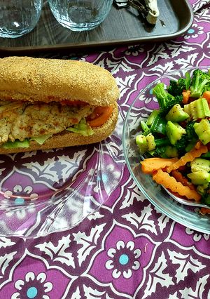 A picture of Egg burger with veg salad.