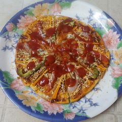 A picture of Vegetables shezwan pizza.