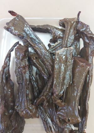A picture of Beef liver jerky, in oven.
