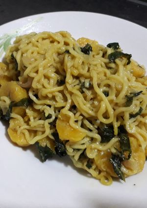 A picture of Indomine with plantain and vegetable(ugu).