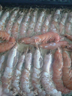 Una foto de Langostinos al horno con champán