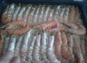 Una foto de Langostinos al horno con champán