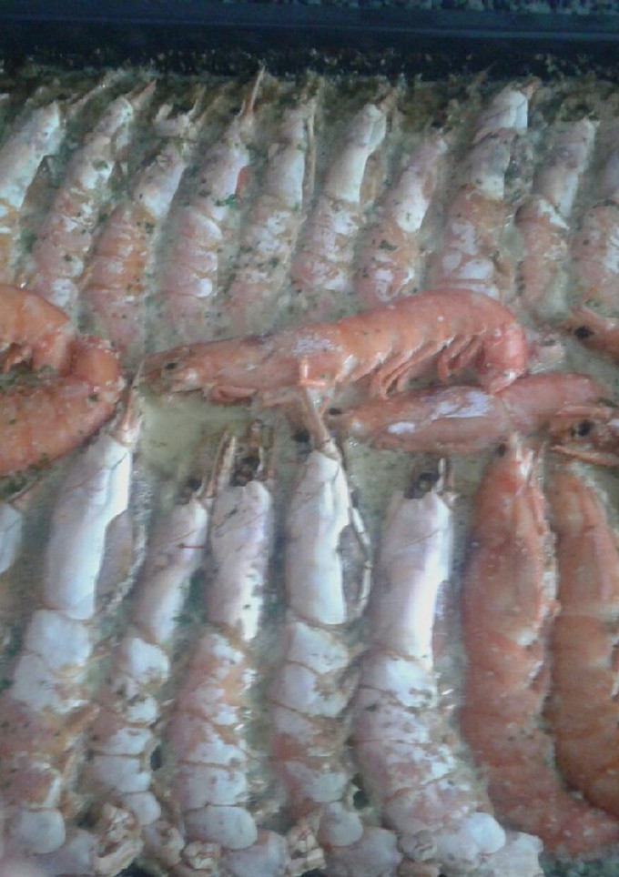 Una foto de Langostinos al horno con champán