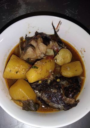 A picture of Cat fish with potatoes.