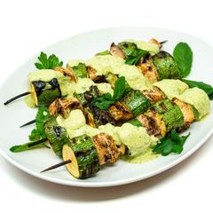 A picture of Herb-Marinated Shark and Zucchini Skewers with Herbed Butter and Herb Yogurt Cream.