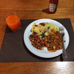 A picture of Beef Stew,Fried Potatoes and Tomato Onion Salad(Kachumbari).