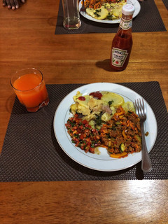 A picture of Beef Stew,Fried Potatoes and Tomato Onion Salad(Kachumbari).