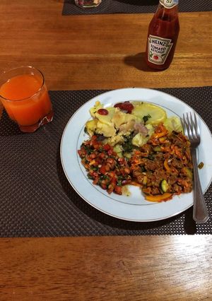 A picture of Beef Stew,Fried Potatoes and Tomato Onion Salad(Kachumbari).