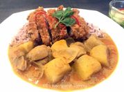 A picture of rice and boneless chicken