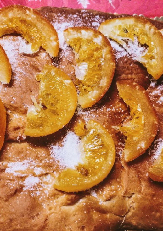 Una foto de Torta de queso crema con naranja escarchada