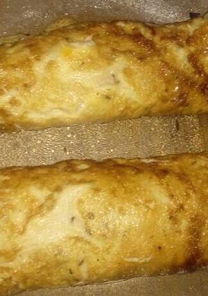 Una foto de Omelette relleno con arroz, queso mantecoso, paleta y huevo duro