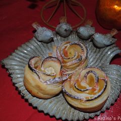 A picture of Apple rose shaped cakes.