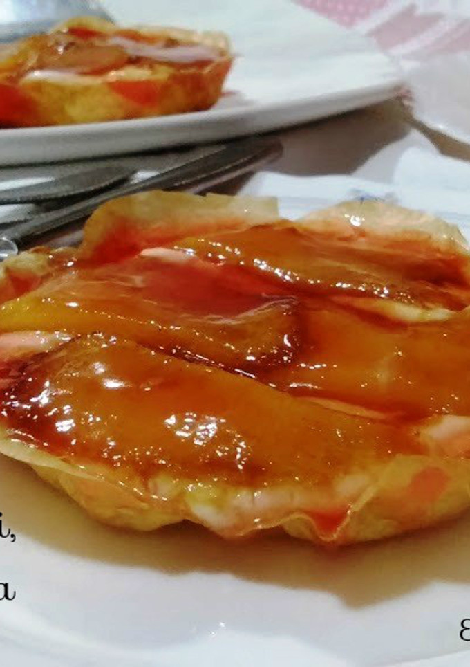 Una foto de Canastillas de caqui sobre mus de queso 