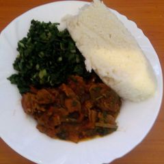 Ugali, steamed spinach and wet fried beef A picture of Ugali, steamed spinach and wet fried beef.