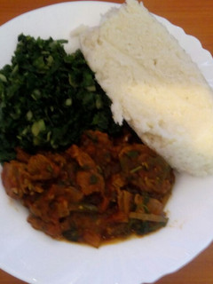 A picture of Ugali, steamed spinach and wet fried beef.