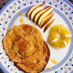 A picture of Eggless mango pancakes with apple sauce.
