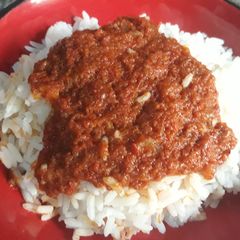 A picture of Boiled rice and stew.