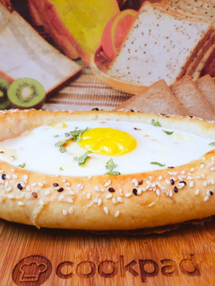 A picture of Khachapuri with four cheese.