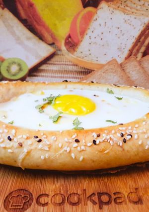 A picture of Khachapuri with four cheese.