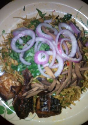 A picture of Warm Abacha with fried fish.