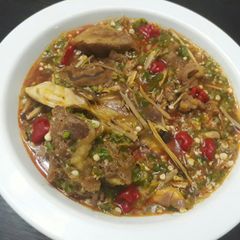 A picture of Okro soup with ugba.