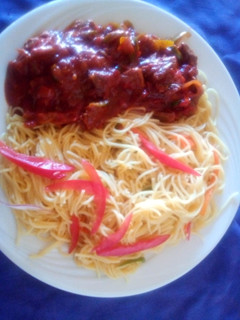 A picture of Steamed spaghetti with beef.