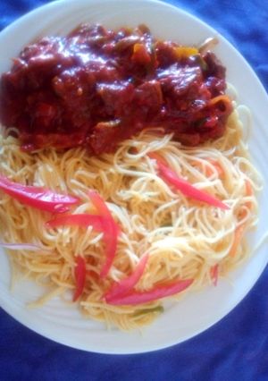 A picture of Steamed spaghetti with beef.