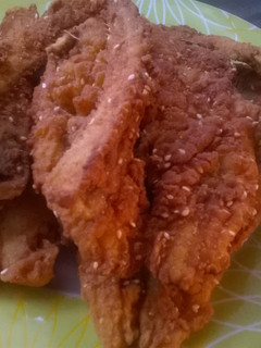 A picture of Fried fish with masala seeds.