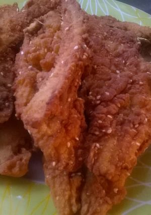 A picture of Fried fish with masala seeds.