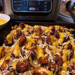 A picture of Buffalo chicken and fries(pizza box 1).