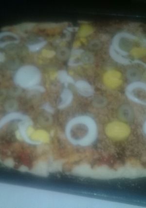 Una foto de Pizza casera con un toquecito de limón