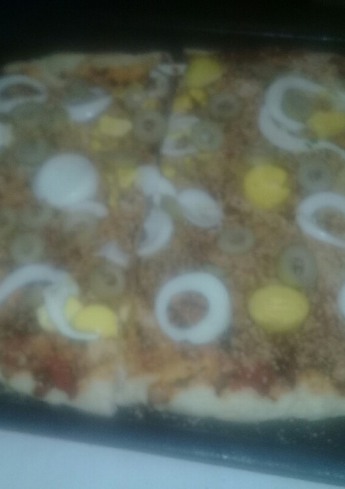 Una foto de Pizza casera con un toquecito de limón