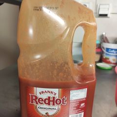 A picture of Buffalo sauce (large, for catering).