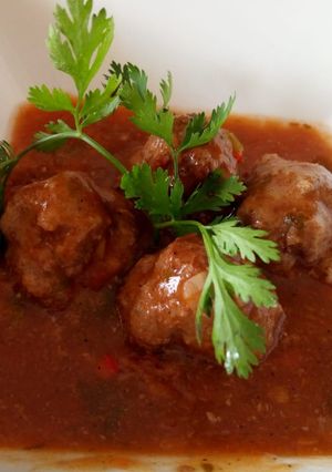 A picture of Meat balls in tomato concasee.