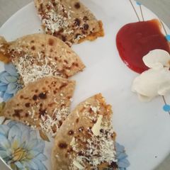 A picture of Spicy sev pyaz or Tamatar ke paratha.