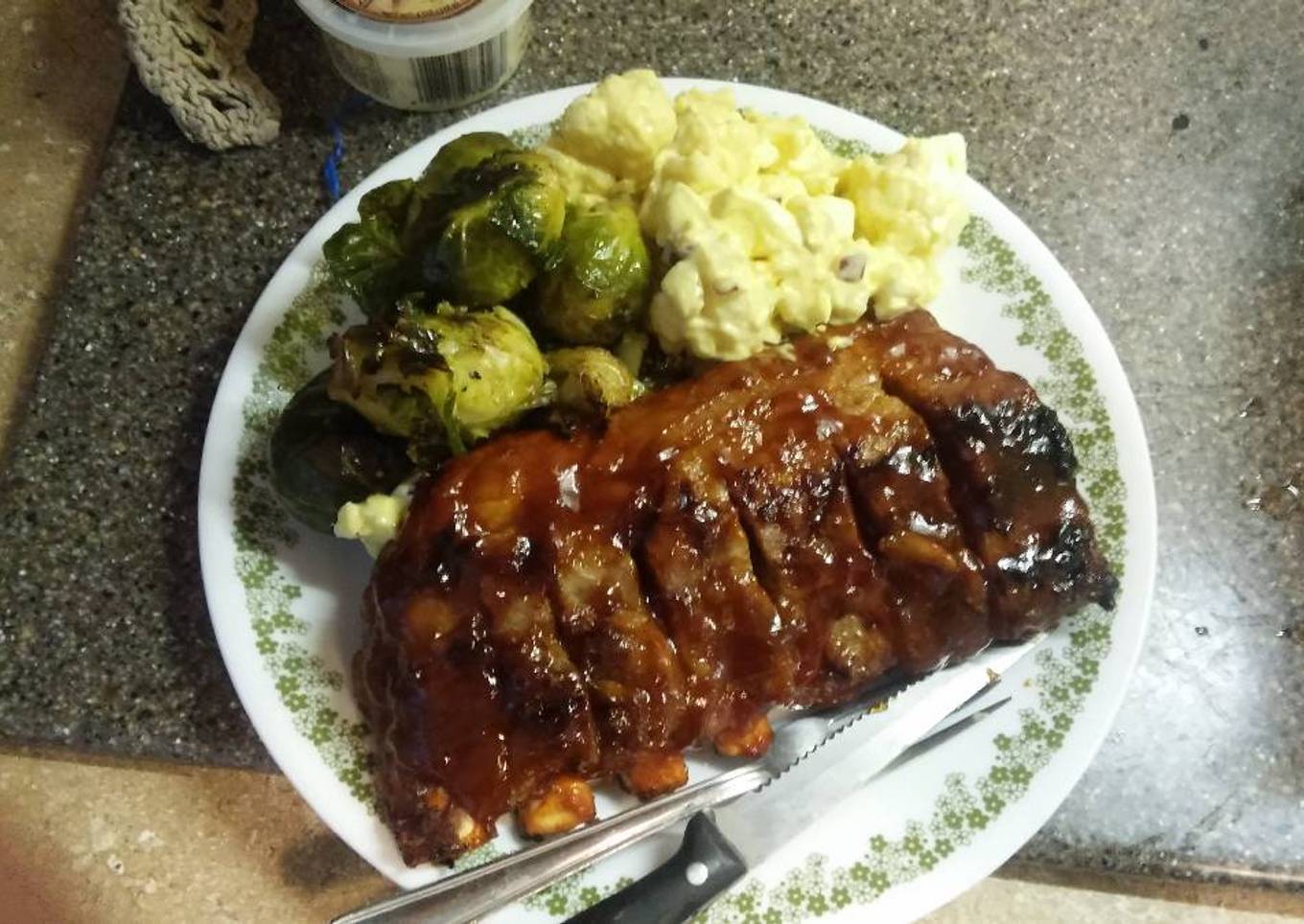 Fried pork ribs without potatoes, potato salad, Brussels sprouts