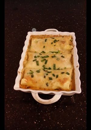 A picture of Crab and Shrimp Enchiladas with Hatch Chili Sauce.
