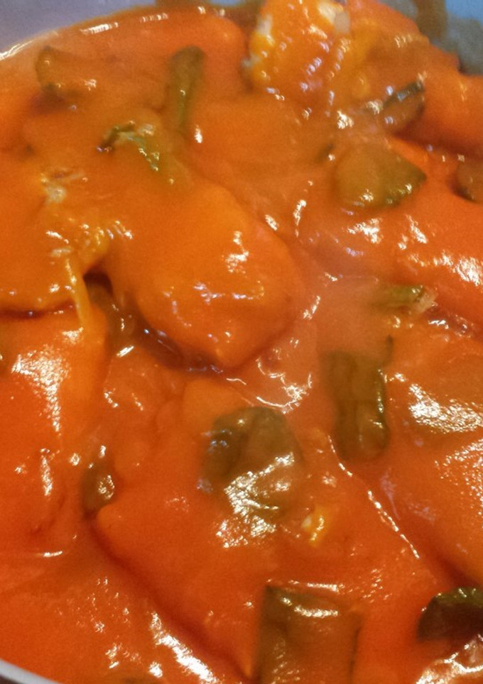 Una foto de Bacalao con tomate y pimientos